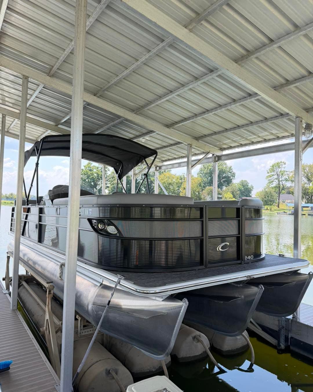 Pontoon boat after a detail, on a lift
