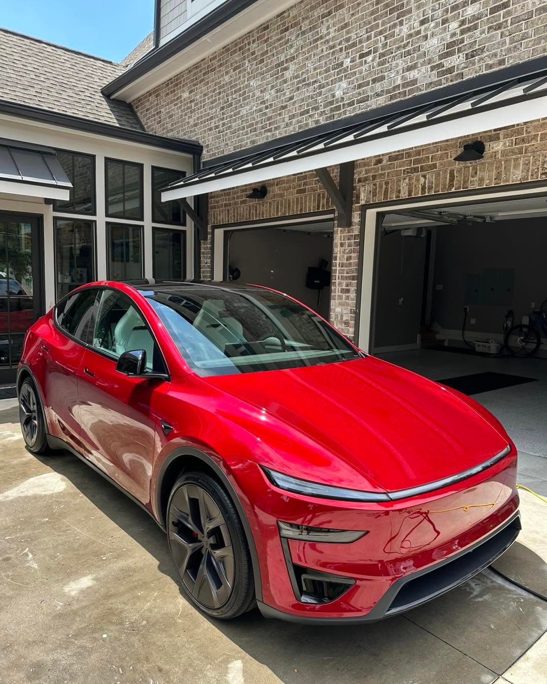 Red Tesla after an exterior detail
