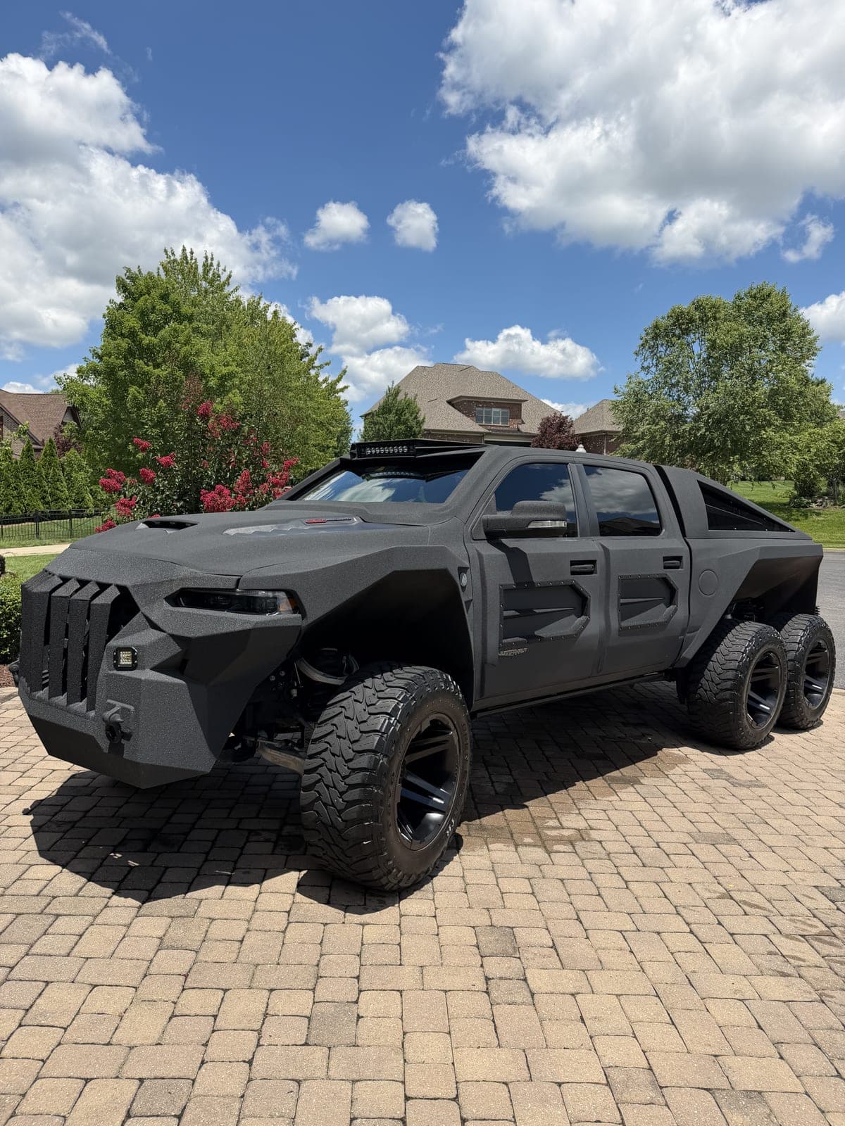 Black custom 6x6 truck after a detail